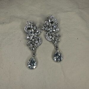 Glamorous Silver Dangle Earrings with Intricate Design